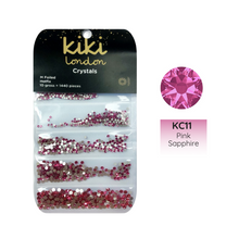 Load image into Gallery viewer, A package of Kiki London Crystals featuring various sizes of pink rhinestones under the label KC11 Pink Sapphire.
